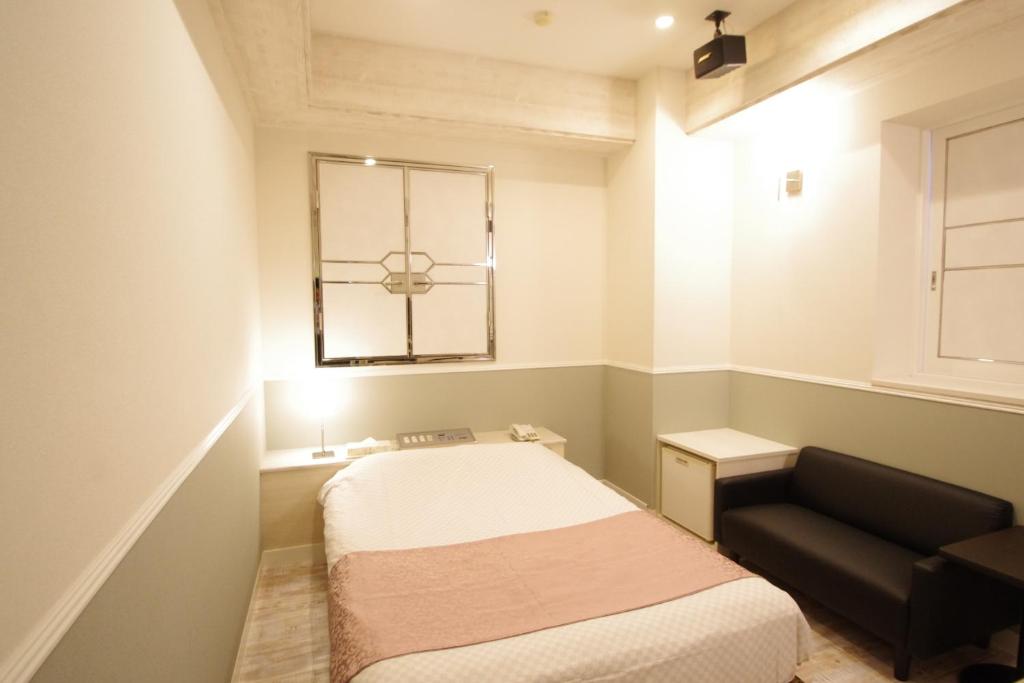 Postel nebo postele na pokoji v ubytování Hotel Crystal -adult only-