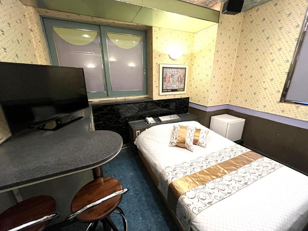 TV a/nebo společenská místnost v ubytování Hotel Crystal -adult only-