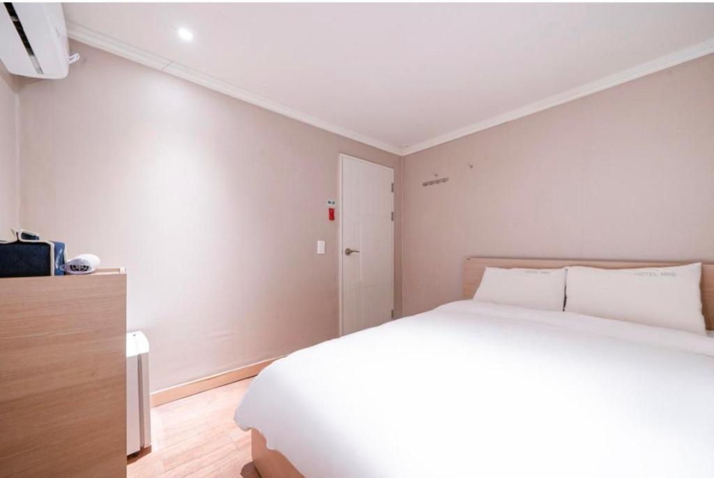 Postel nebo postele na pokoji v ubytování HOTEL mini