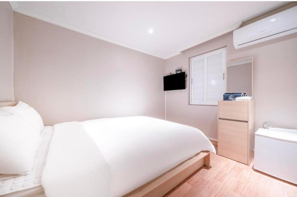 Postel nebo postele na pokoji v ubytování HOTEL mini