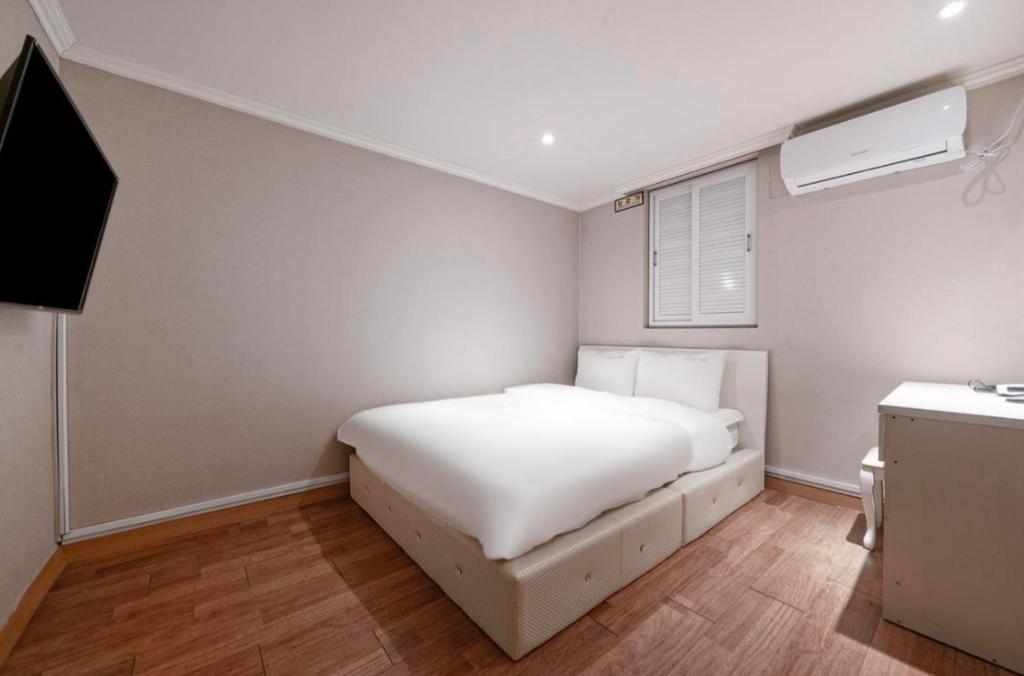 Postel nebo postele na pokoji v ubytování HOTEL mini