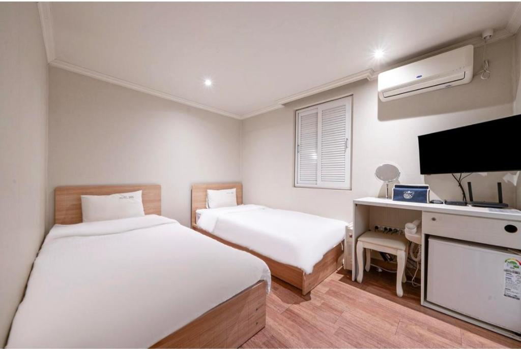 Postel nebo postele na pokoji v ubytování HOTEL mini