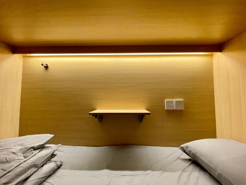 Postel nebo postele na pokoji v ubytování Pomelo Hostel Xingping