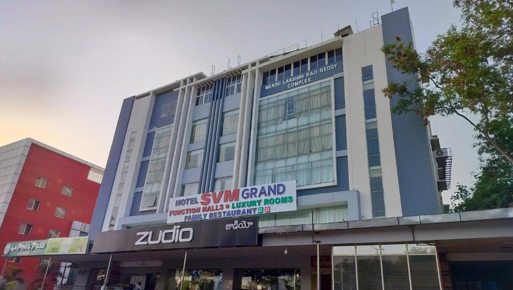 a building with a sign on the front of it at HOTEL SVM GRAND RAMANTHAPUR in Hyderabad