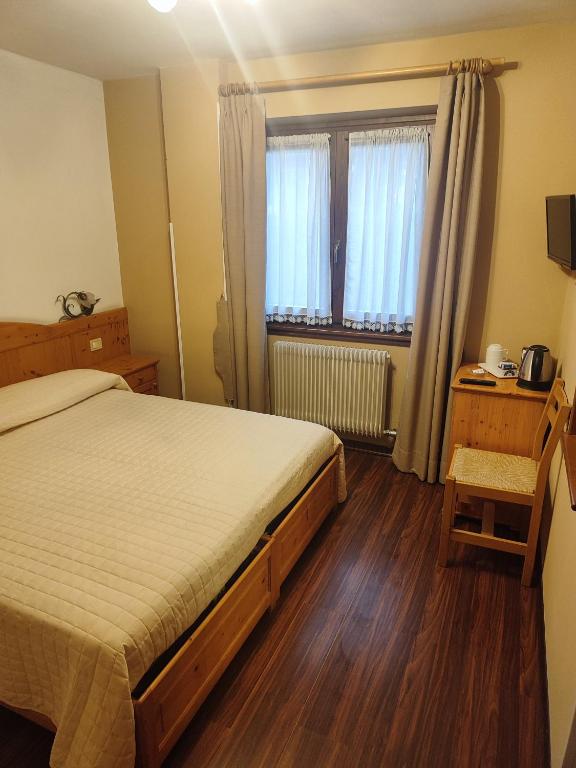 Postel nebo postele na pokoji v ubytování Garnì Bonsai