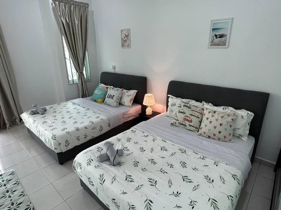 Voodi või voodid majutusasutuse Cendana House@Juru/Autocity/Bkt Minyak/Batu Kwan/IKEA toas