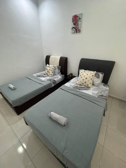Voodi või voodid majutusasutuse Cendana House@Juru/Autocity/Bkt Minyak/Batu Kwan/IKEA toas