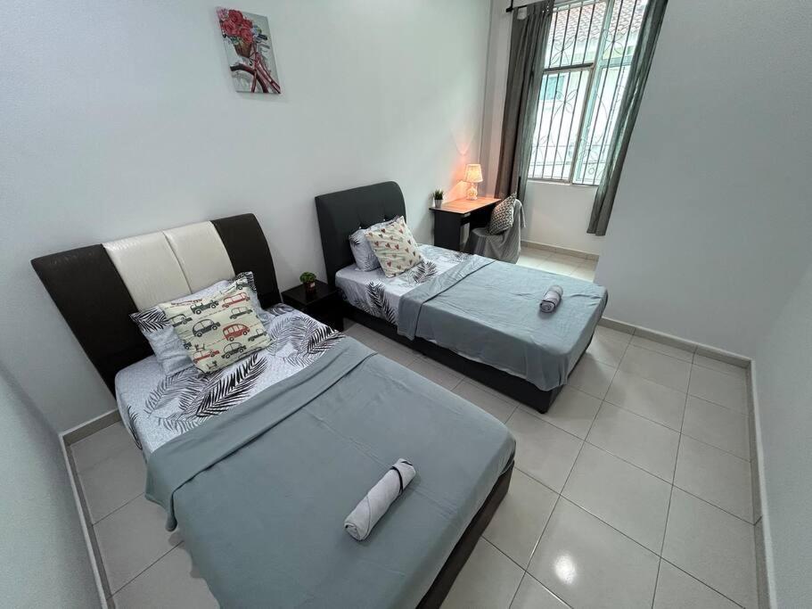 Voodi või voodid majutusasutuse Cendana House@Juru/Autocity/Bkt Minyak/Batu Kwan/IKEA toas