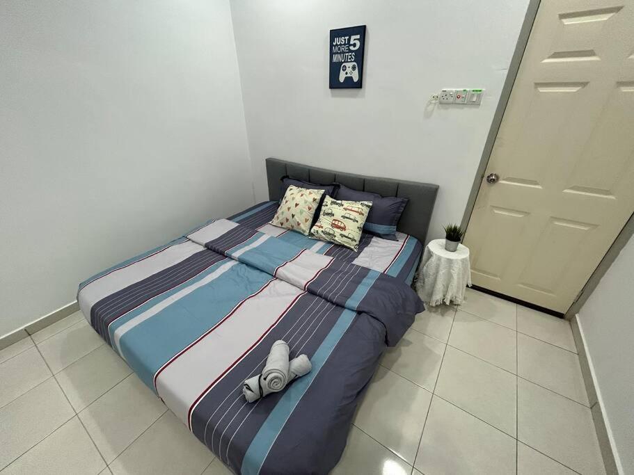 Voodi või voodid majutusasutuse Cendana House@Juru/Autocity/Bkt Minyak/Batu Kwan/IKEA toas