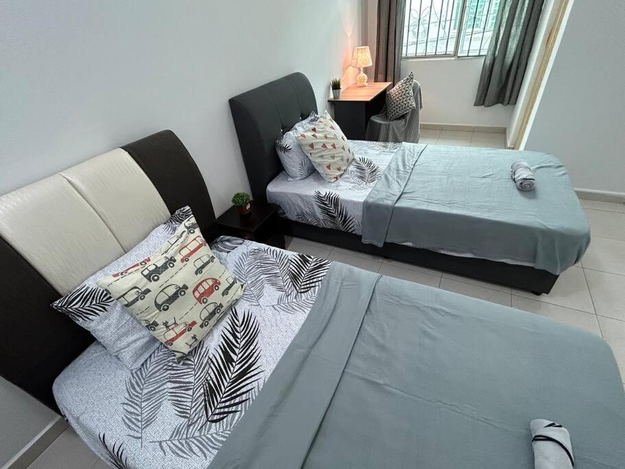 Voodi või voodid majutusasutuse Cendana House@Juru/Autocity/Bkt Minyak/Batu Kwan/IKEA toas