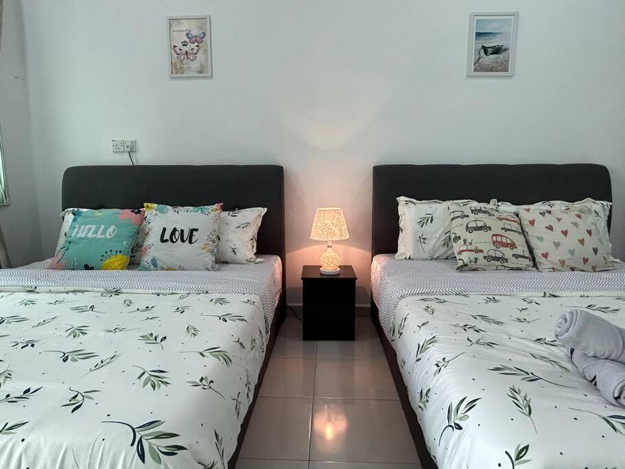 Voodi või voodid majutusasutuse Cendana House@Juru/Autocity/Bkt Minyak/Batu Kwan/IKEA toas