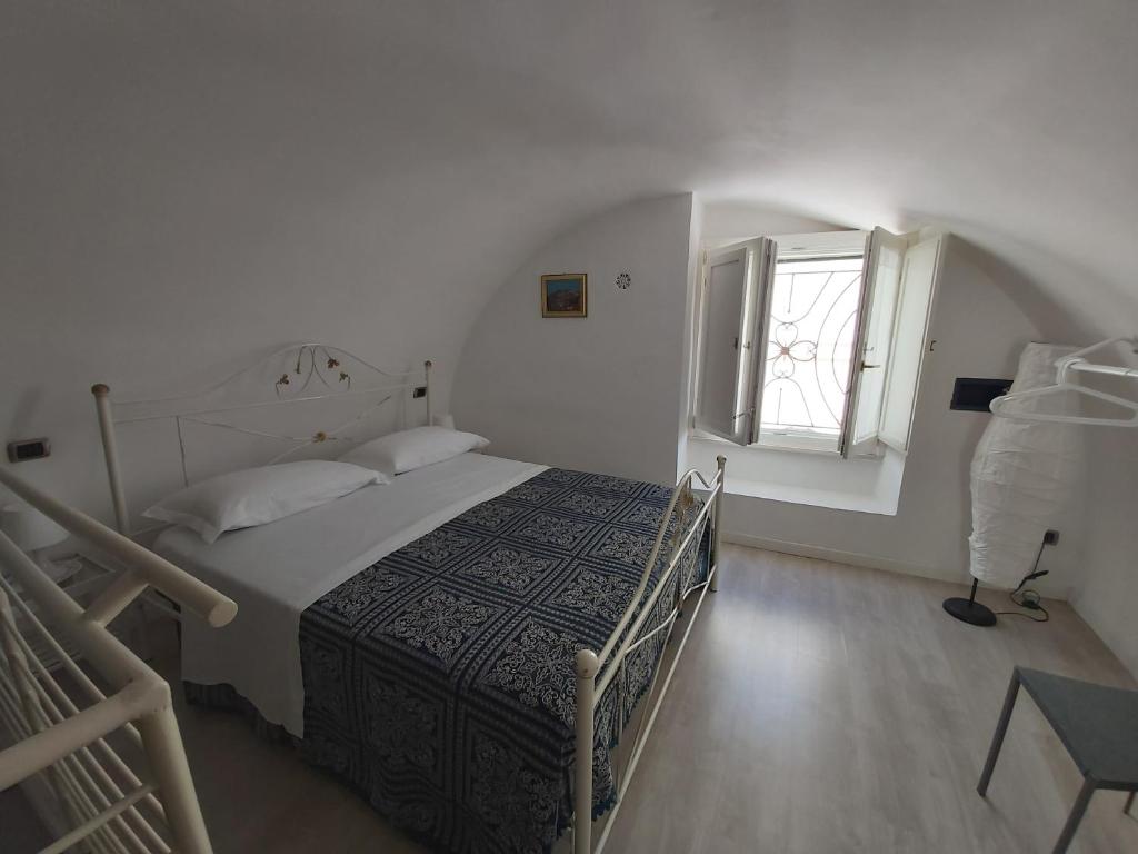 Postel nebo postele na pokoji v ubytování Dimora Margherita