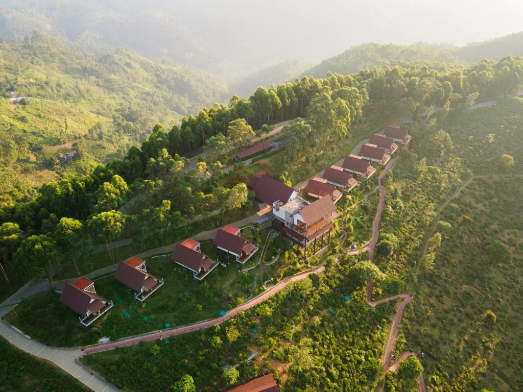 an aerial view of a farm with houses and trees at Anasa Wellness Resort in Ella