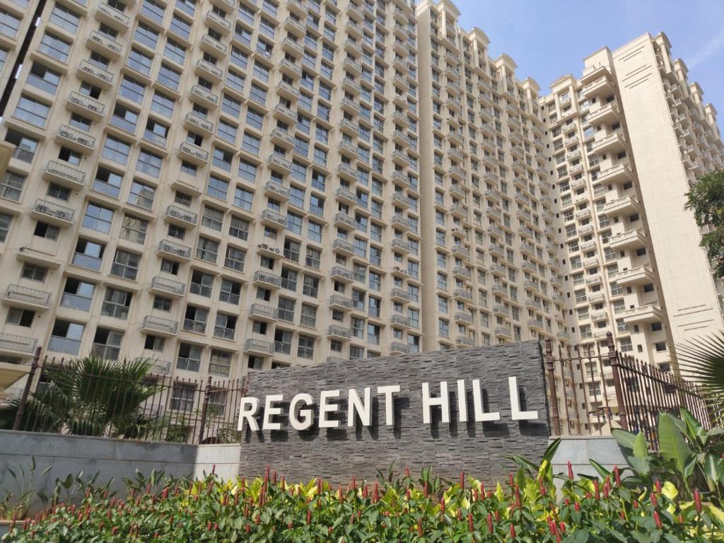 a sign in front of a apartment building at Sapphire Asta- Regent Hills in Mumbai