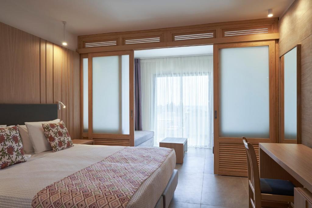 Postel nebo postele na pokoji v ubytování Atlantica Mikri Poli Rhodes