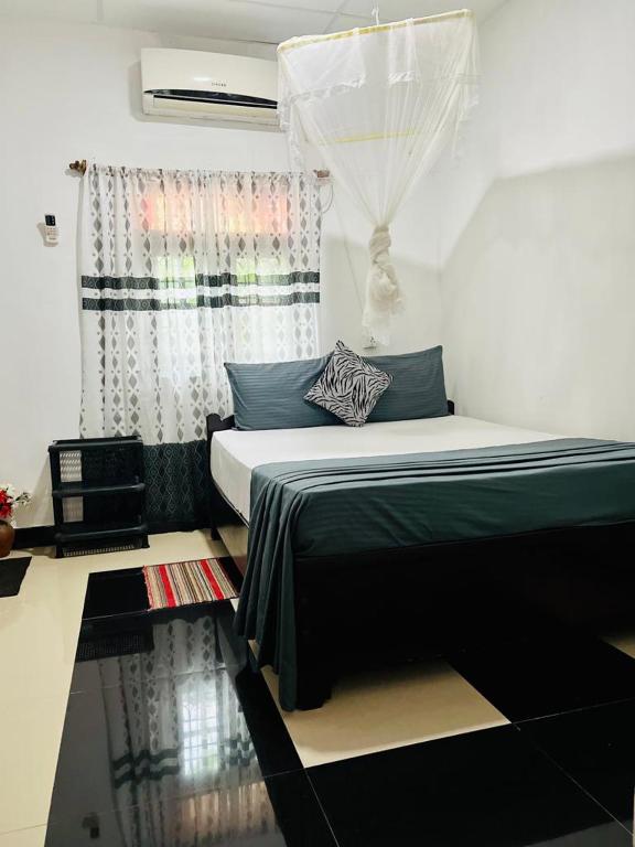Postel nebo postele na pokoji v ubytování Village feel home stay