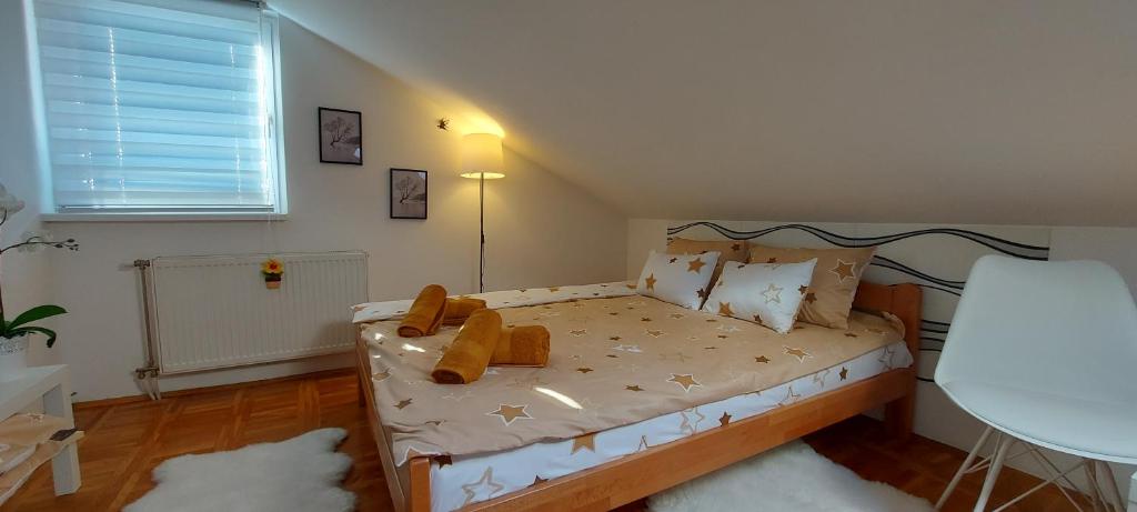 a small bedroom with a bed in a room at Apartman "Andjela" in Belgrade