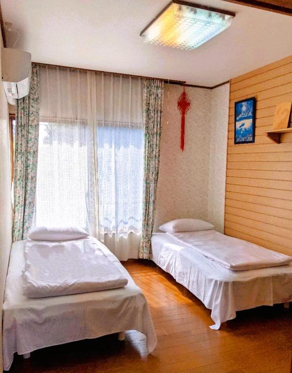 Postel nebo postele na pokoji v ubytování 花源