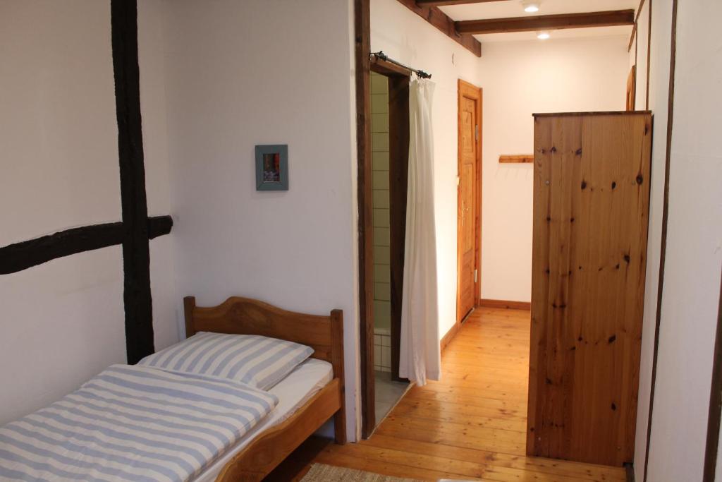 Postel nebo postele na pokoji v ubytování Das Abendrote Haus