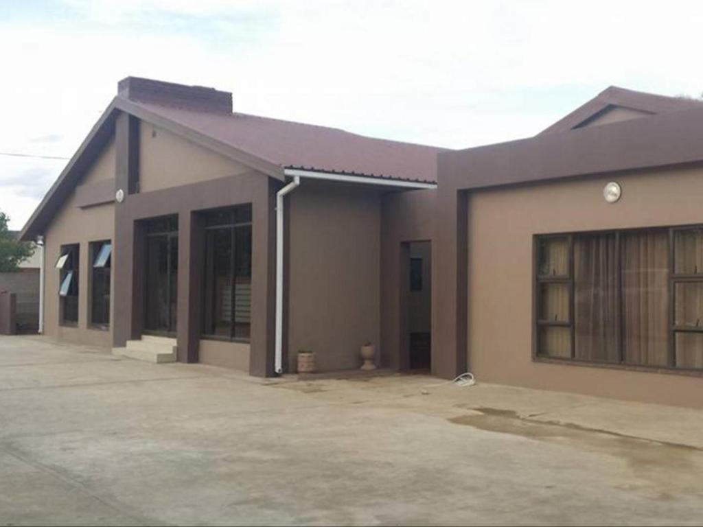 a large building with a lot of windows at Emangweni Guest House in Vryheid