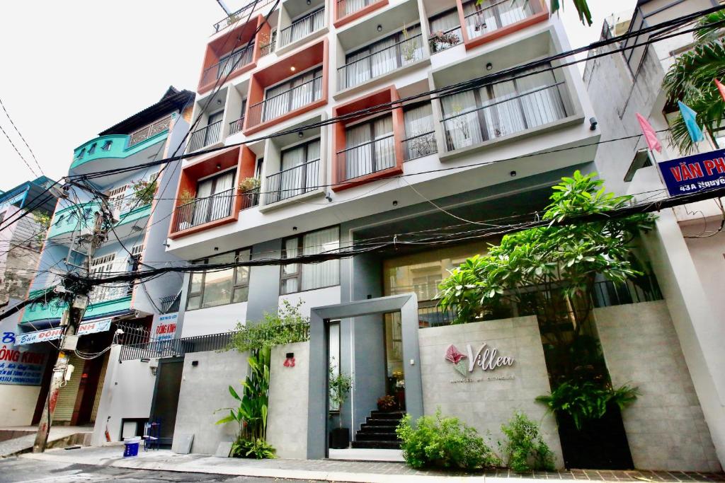 an apartment building with a door in a city at Cityhouse Villea in Ho Chi Minh City