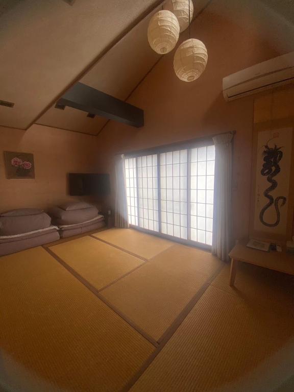 Postel nebo postele na pokoji v ubytování Minato Oasis Numazu / 沼津観光の中心、伊豆観光の拠点に好立地！沼津港に位置し交通・飲食・コンビニ等至便です！