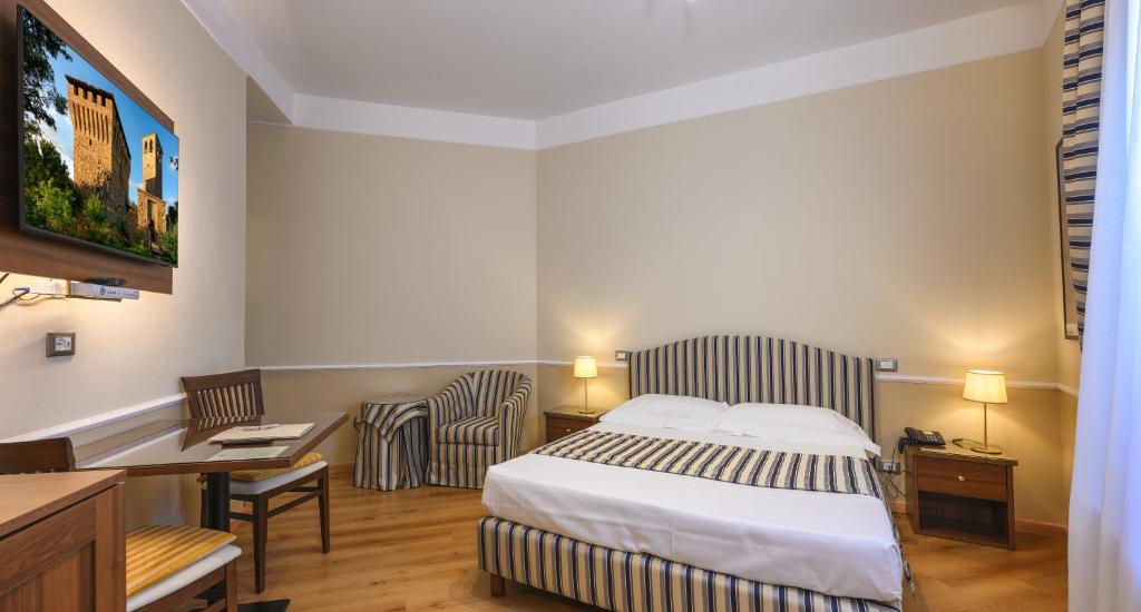 Postel nebo postele na pokoji v ubytování Albergo Reggio