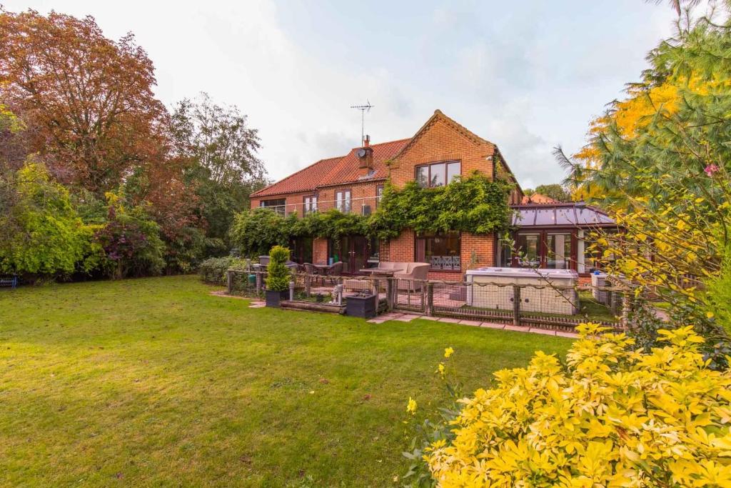 a large house with a yard in front of it at Four Seasons in Norwich