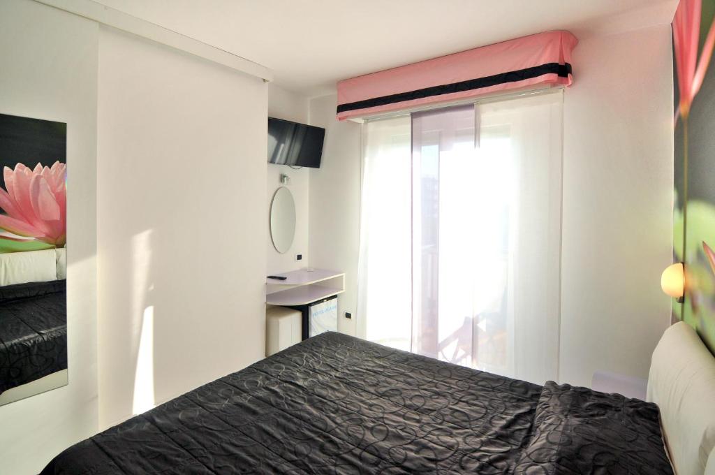 Postel nebo postele na pokoji v ubytování Hotel Oliver