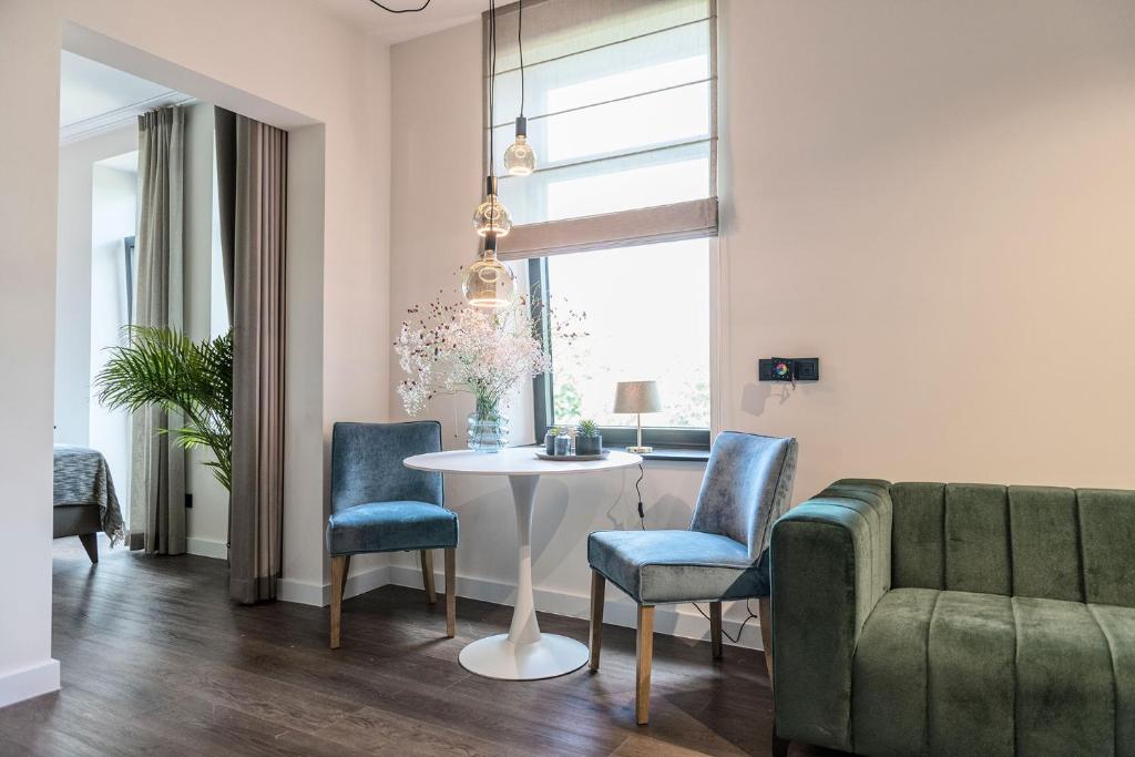 Posezení v ubytování Hof van In & Wellness