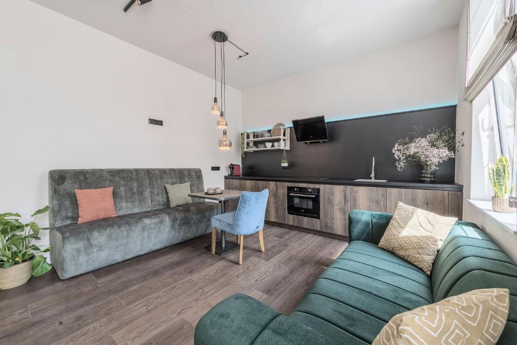 Kuchyň nebo kuchyňský kout v ubytování Hof van In & Wellness