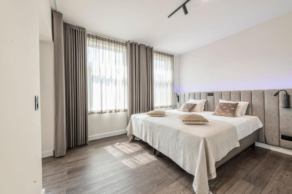 Postel nebo postele na pokoji v ubytování Hof van In & Wellness