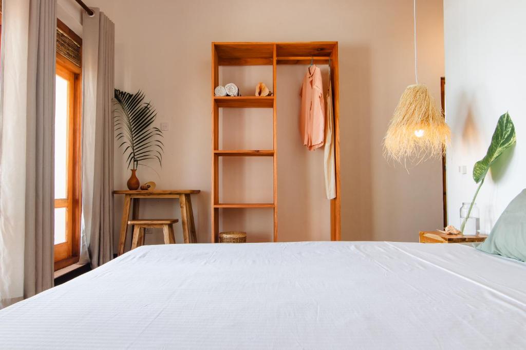Postel nebo postele na pokoji v ubytování Amaroo Hikkaduwa