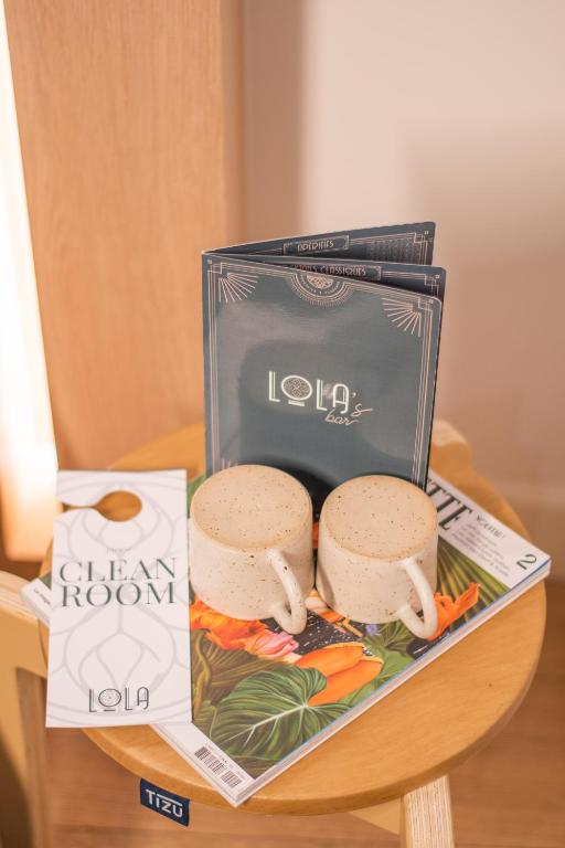 a lunch box with two sandwiches on a table at LOLA Boutique Hôtel - Bordeaux Centre in Bordeaux