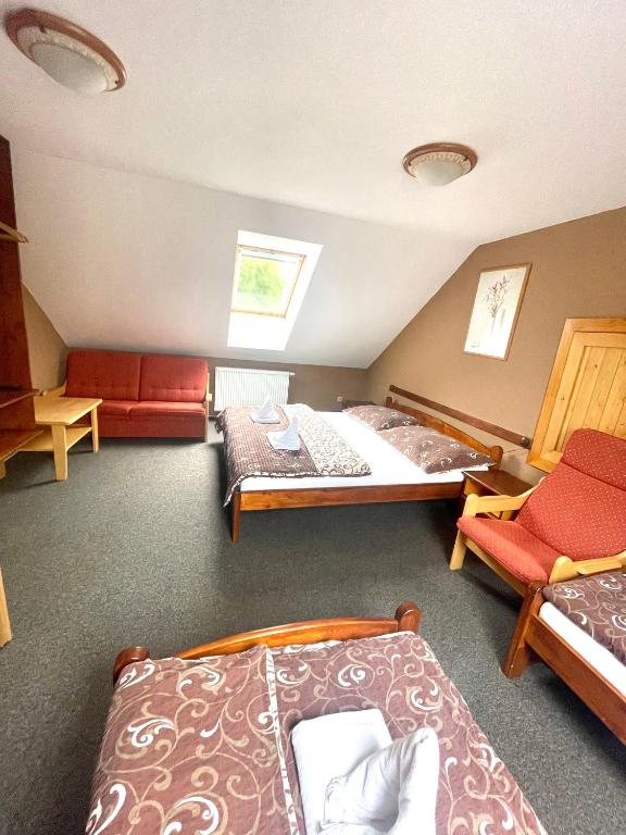 Postel nebo postele na pokoji v ubytování Penzion a restaurace U Nováků