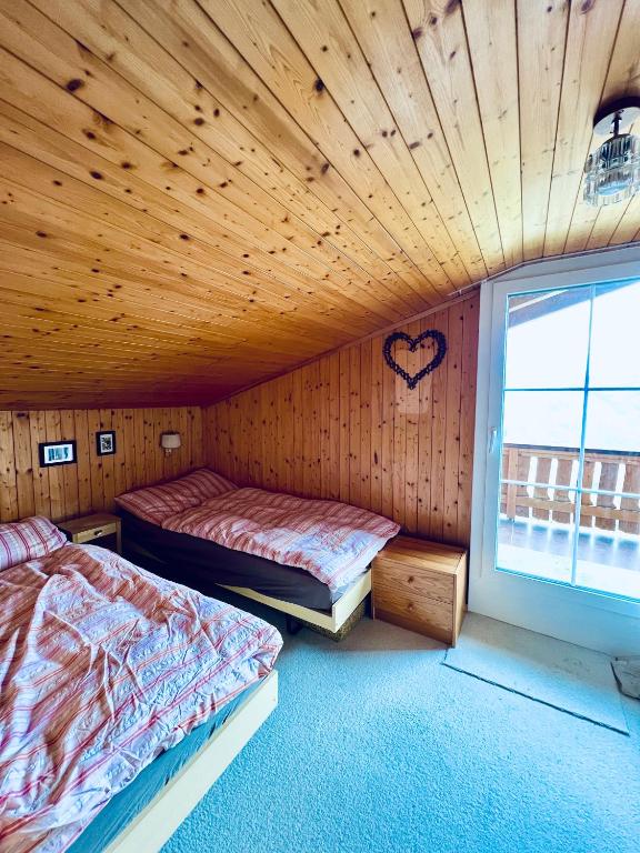 Postel nebo postele na pokoji v ubytování Chalet Gauschla - CharmingStay