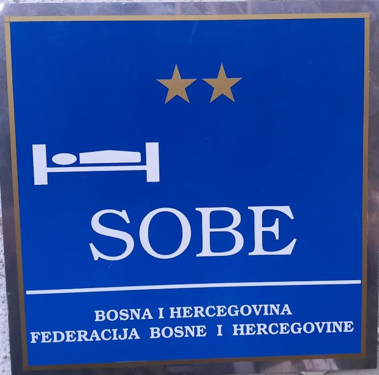 a blue sign that says socket with stars on it at Apartman Sadba in Goražde