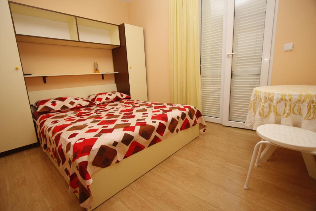 Postel nebo postele na pokoji v ubytování Apartments Lidus
