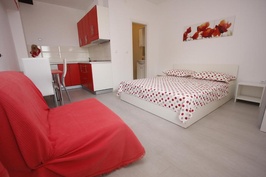 Postel nebo postele na pokoji v ubytování Apartments Lidus