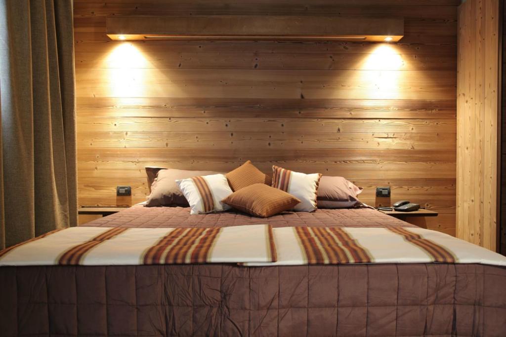 Łóżko lub łóżka w pokoju w obiekcie Hotel La Chance
