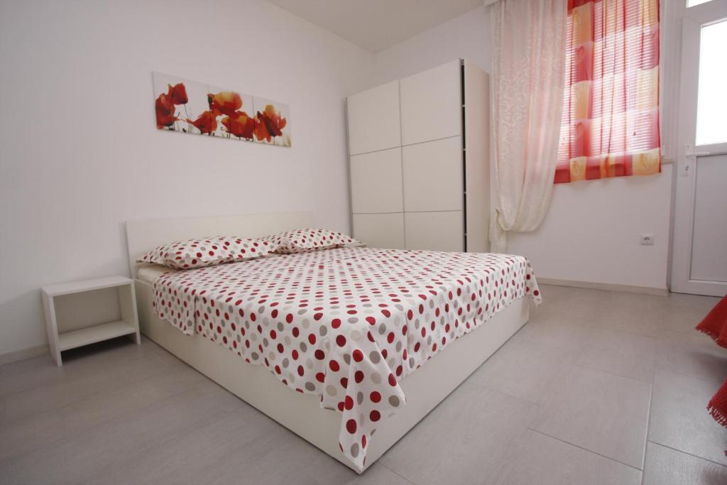 Postel nebo postele na pokoji v ubytování Apartments Lidus