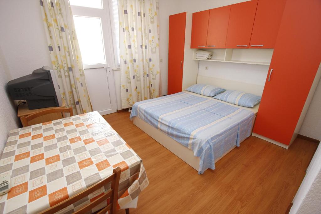 Postel nebo postele na pokoji v ubytování Apartments Lidus
