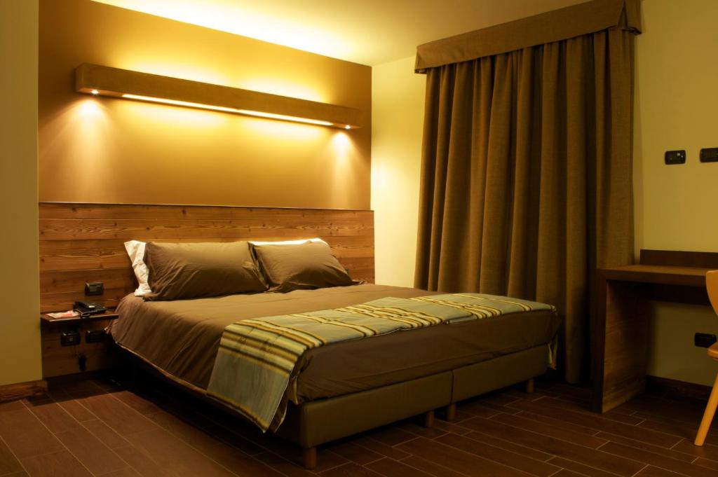 Łóżko lub łóżka w pokoju w obiekcie Hotel La Chance