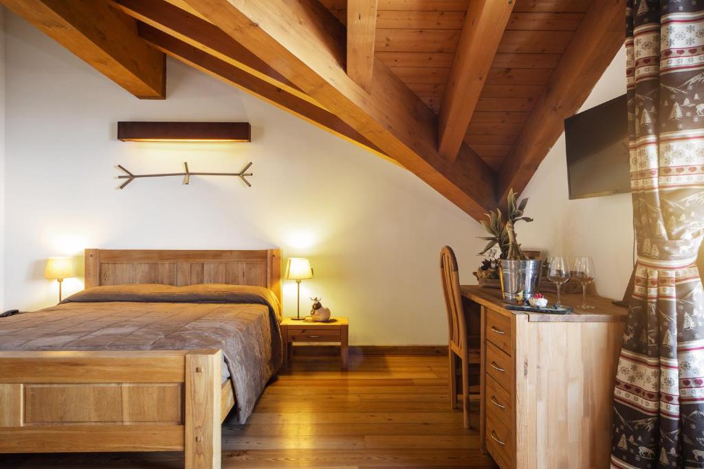 Łóżko lub łóżka w pokoju w obiekcie Hotel La Chance