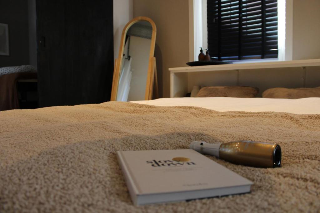 a book sitting on top of a bed at Sparkle privé wellness B&B in Franeker