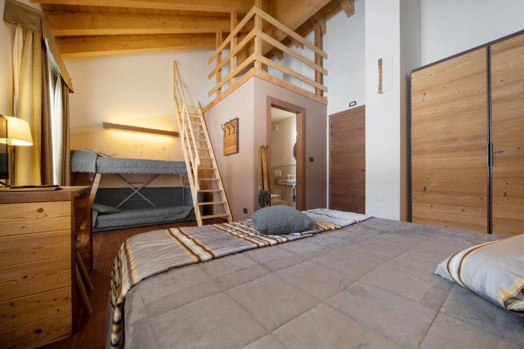 Łóżko lub łóżka w pokoju w obiekcie Hotel La Chance