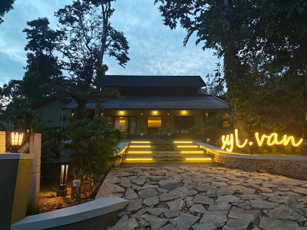 a building with a bunch of lights in front of it at SylVan Resort in Wayanad