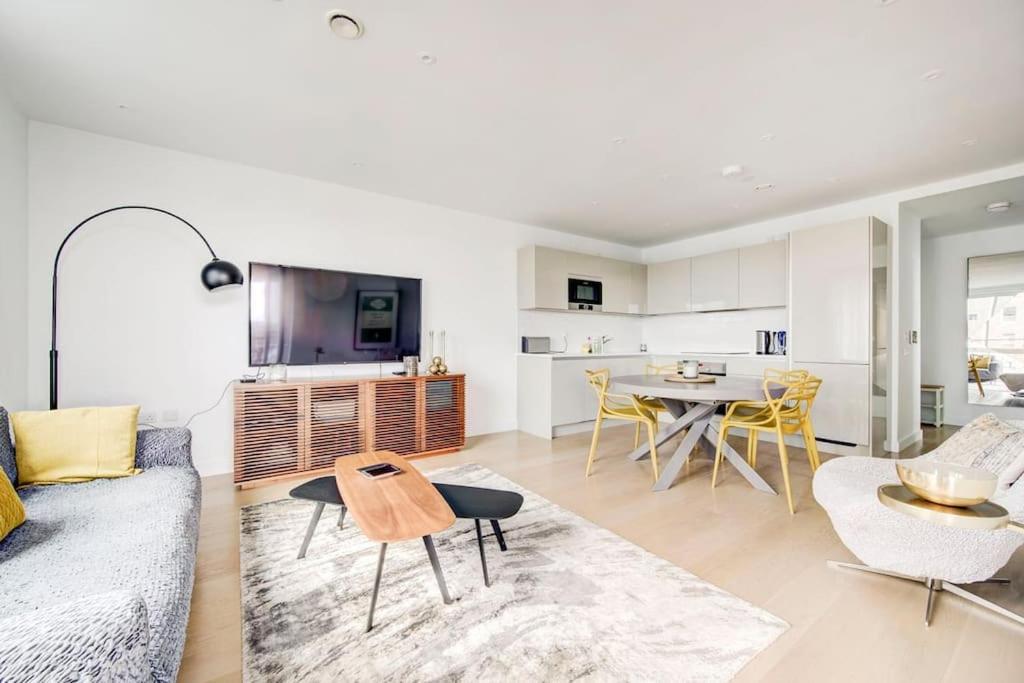 a living room with a couch and a table at GuestReady - Chic Urban Haven in Walworth in London