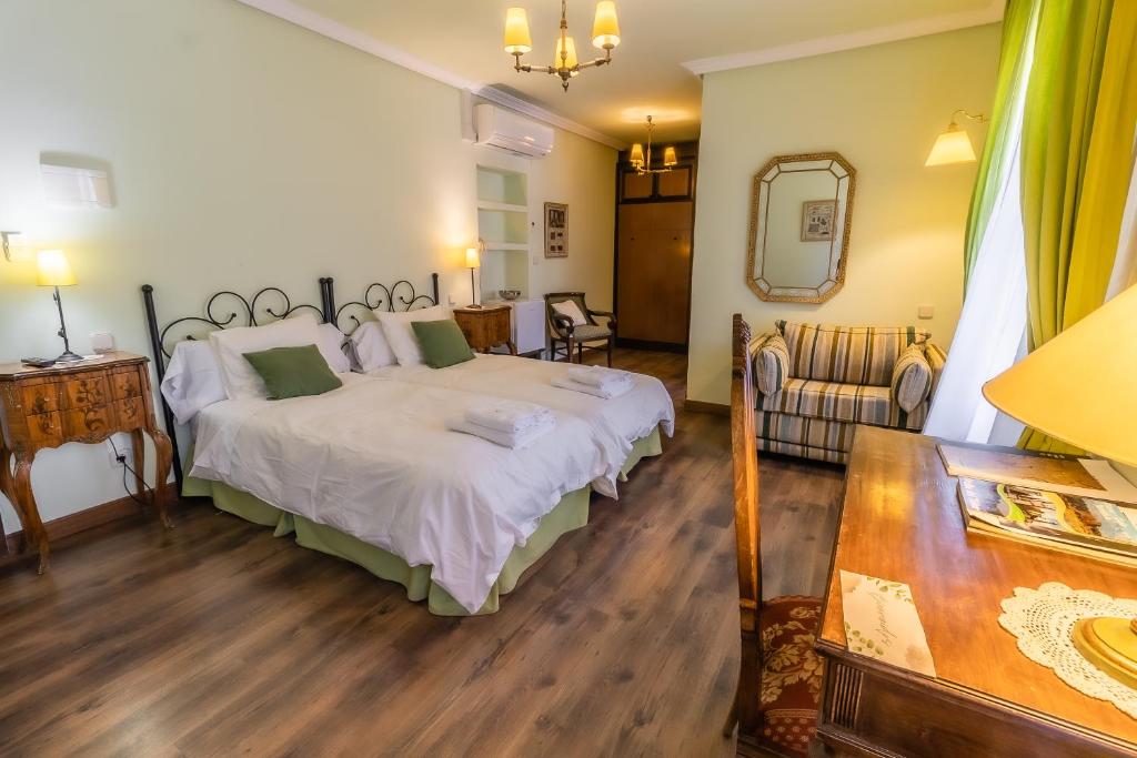 Llit o llits en una habitació de Posada Real Quinta San Jose