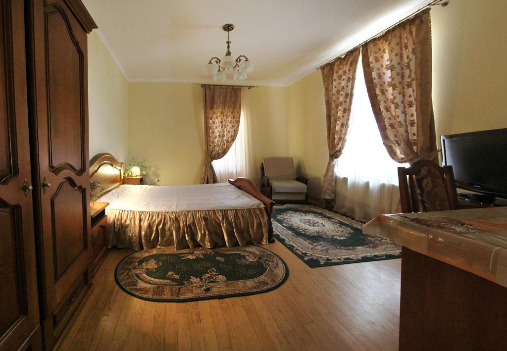 Postel nebo postele na pokoji v ubytování VillaPark
